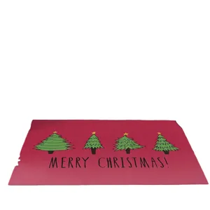 Red Christmas rug with green trees and Merry Christmas text for home decoration