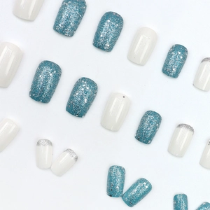 Short square press-on nails set with glitter blue, solid white, and silver french tips