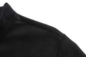 Detail of shoulder seam and matte suede texture on a slim fit black casual jacket