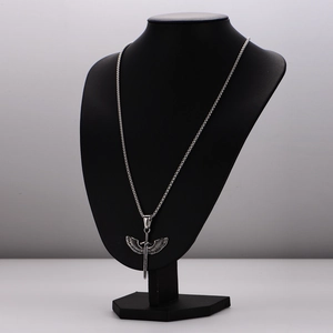 Vintage stainless steel angel wing and sword pendant necklace for men on a black display