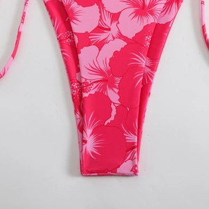 Detail of pink tropical hibiscus print bikini bottom with delicate side-tie strings