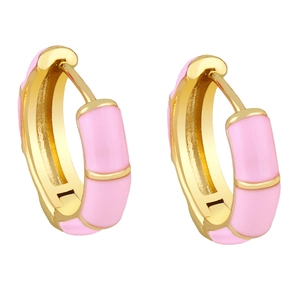 Detailed close-up of pink enamel and gold-plated bamboo joint style hoop earrings