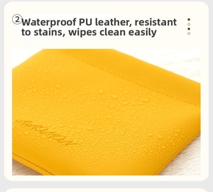 Waterproof yellow PU leather pouch close-up showing liquid beads on lychee grain texture