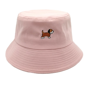 Detailed view of pink cotton bucket hat featuring cute cartoon puppy embroidery and stitching