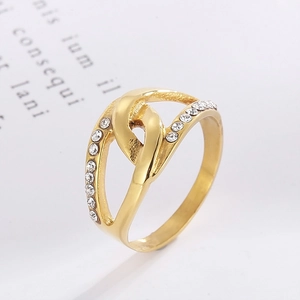 Macro shot of gold-plated leaf-style ring with micro-set zircon on twisted band