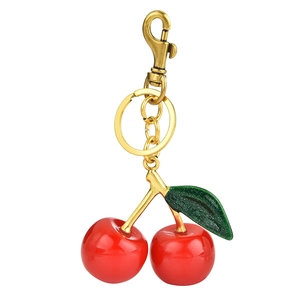 Chic red resin cherry keychain with gold metal clasp and glitter green leaf pendant