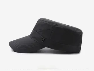 Detail view of quick-dry fabric texture and metal triangle logo on the dark grey cadet cap