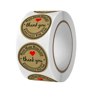 Kraft paper stickers roll with red heart and Hand Made With Love text on white background