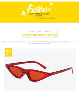 Detail view of red cat-eye sunglasses featuring spring hinges and metal stud accents