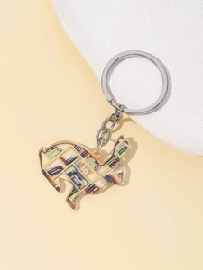 Detail of acrylic cat keychain featuring a colorful library bookshelf pattern with metal ring