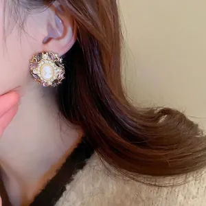 Baroque style relief portrait earrings with purple rhinestones on golden base