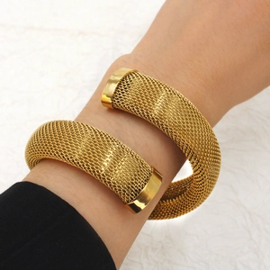 French vintage 18K gold plated mesh crossover bangle with zircon set on a wrist