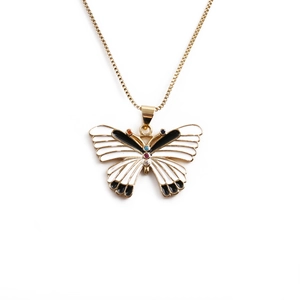 Gold butterfly necklace with black and white enamel and colorful crystals on a thin chain