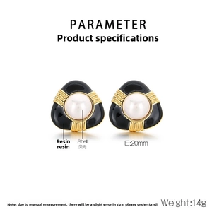 Detail of vintage French resin pearl earrings with gold accents on a white background