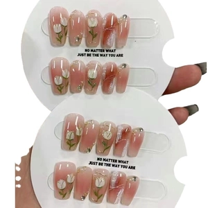 Handmade press-on nails with 3D tulip patterns and pink blush gradient design