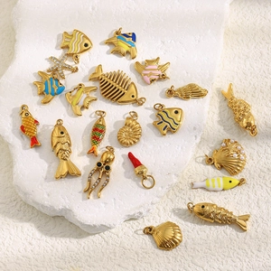 Detailed view of 18K gold plated ocean charm collection with colorful enamel inlay