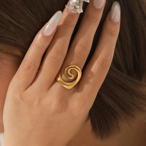 Polished 18K gold plated stainless steel spiral ring worn on finger with elegant styling
