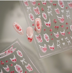 Detail of KX487 nail stickers with pink floral borders and white lace bow designs