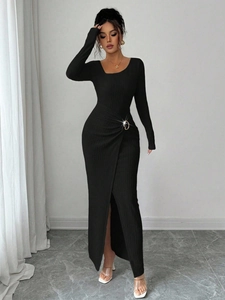 Close-up of knit dress waist with elegant crossover knot and metallic ring buckle detail