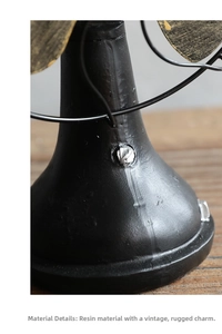 Macro detail of retro resin electric fan ornament with industrial distressed finish