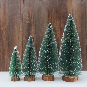 Set of 4 mini artificial green Christmas trees with snow effect and wooden bases