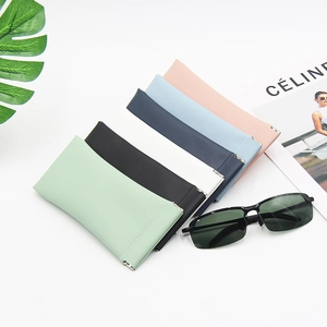 Detailed close-up of six-color PU leather eyeglass pouches with automatic metal closure