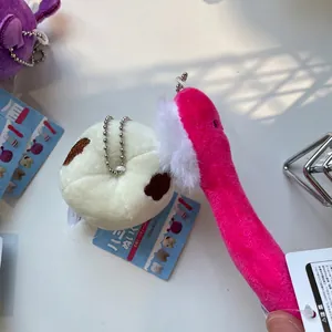 Cute plush keychain set featuring a pink toothbrush and white tooth mascot with bead chain