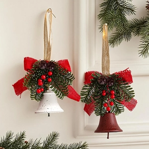 Detail of Christmas bell pendants with pine cones and festive red burlap bows