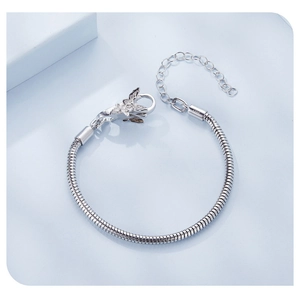 Close-up of S925 sterling silver snake chain with butterfly clasp and lobster buckle details