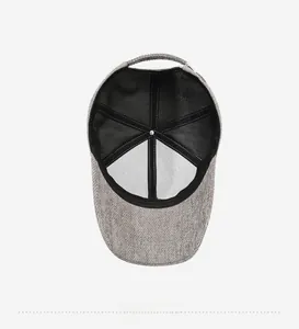 Detailed interior view of grey herringbone baseball cap with black mesh lining and reinforcement