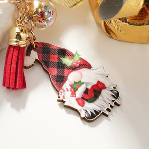Christmas gnome keychain with red buffalo plaid hat, red tassel, and star sequin glass ball