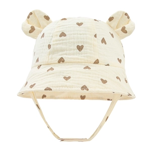 Detail of baby cotton bucket hat with heart print and cute round ear decorations