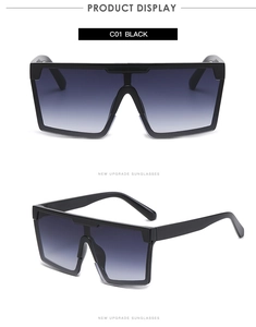 Detail of square oversized sunglasses with black frame and purple-blue gradient lenses