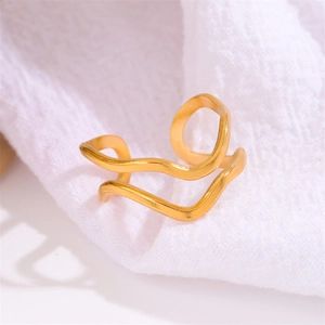 Minimalist double-layered gold-plated wavy open ring for women on white linen texture