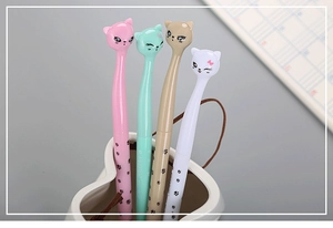 Detailed view of four colorful cat-themed gel pens with cute paw prints and hanging loops