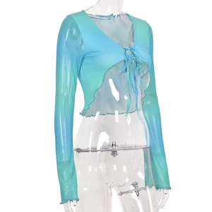 Detail view of the gradient mesh top featuring a self-tie front and ruffled edges