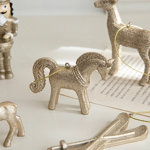 Golden glittery horse ornament for Christmas tree decoration in Nordic minimalist style