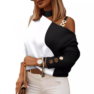 Top asimétrico blanco y negro para mujer con mangas largas y botones dorados