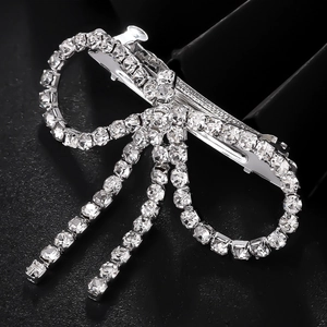 Elegant silver butterfly bow hair clip with sparkling rhinestones and tassel detail