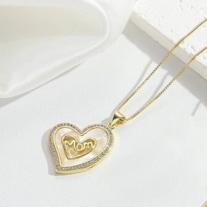 Detail of Mom heart pendant necklace featuring sparkling white zircon and shell base