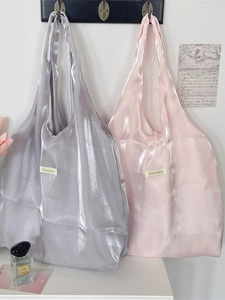 Elegant satin tote bags in silver and pink colors with a soft glossy texture