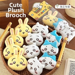 Detailed macro view of cute plush cat brooch collection with high-quality embroidery