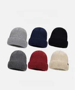 Close-up of ribbed knit beanies in six colors featuring warm fleece lining and leather patch