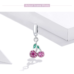 Detail of s925 silver cherry pendant featuring pink and red sparkling crystals