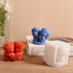 Detailed silicone mold showing rose heart bear candles on a light wooden table