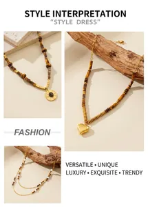 Detail of tiger eye stone necklaces with gold heart charms and layered bead design