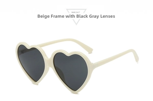 Detailed side view of heart-shaped cream sunglasses featuring durable metal hinges