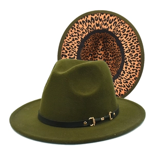 Close-up of wool fedora hat with leopard print brim and gold buckle detailing