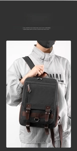 Detail view of washed canvas chest bag with brown leather buckle and front flap pocket