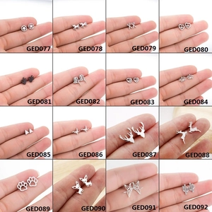 Minimalist animal stud earrings set in silver and black featuring multiple geometric designs